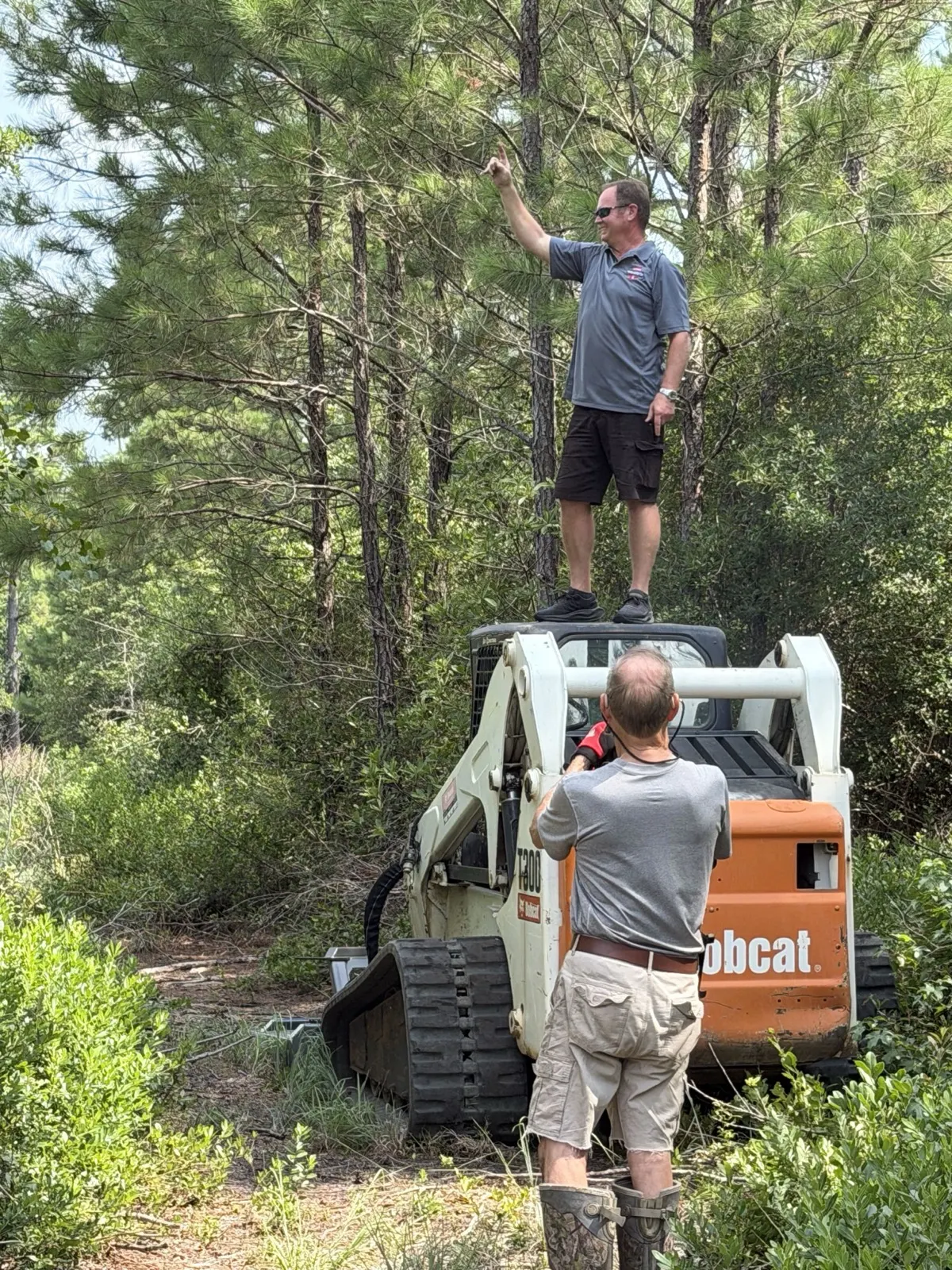 Standing on the Bobcat T300 mulcher on a clearing job